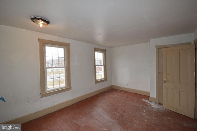 empty room with wood-type flooring