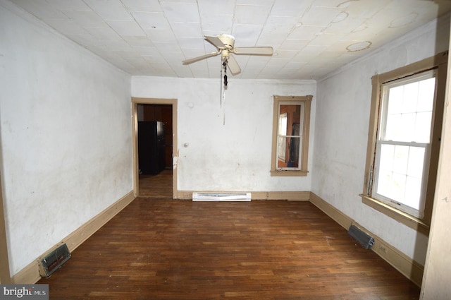 spare room featuring dark hardwood / wood-style flooring and ceiling fan