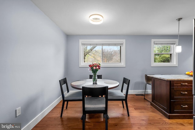 dining space featuring light hardwood / wood-style floors