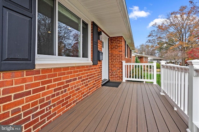 wooden terrace featuring covered porch