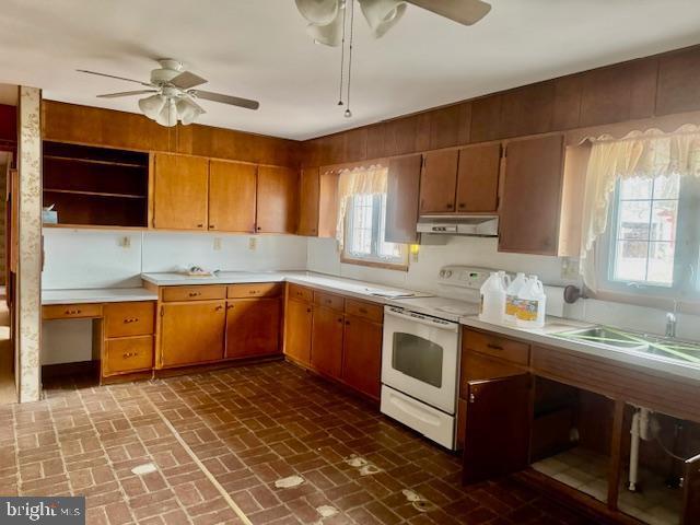 kitchen with ceiling fan and electric stove