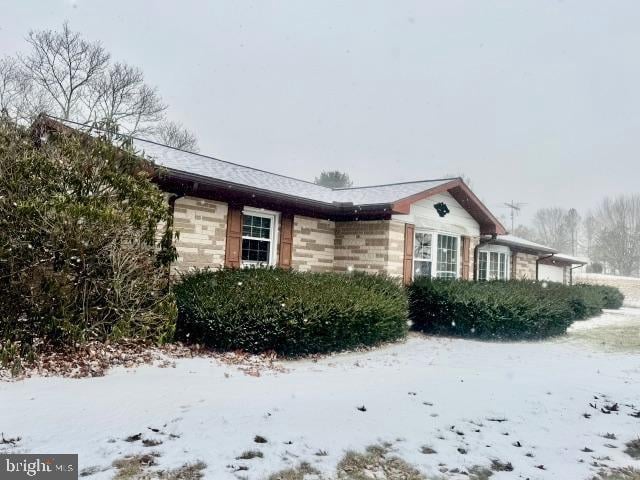 view of snow covered property