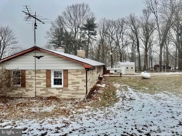 view of snow covered property