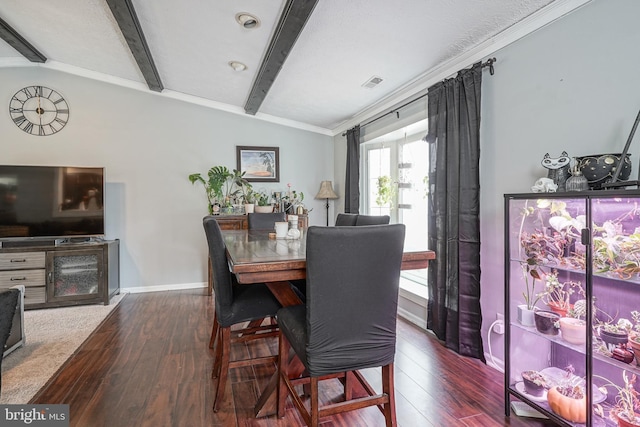 dining space with crown molding, dark hardwood / wood-style flooring, and lofted ceiling with beams