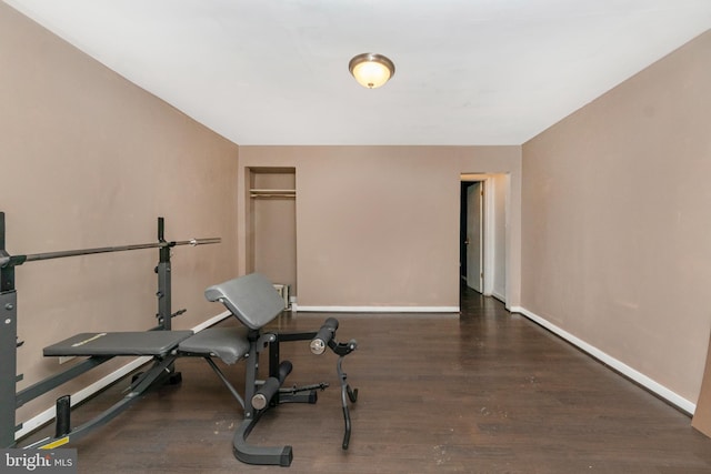 workout area with dark hardwood / wood-style floors