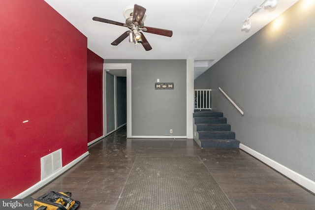 interior space with ceiling fan