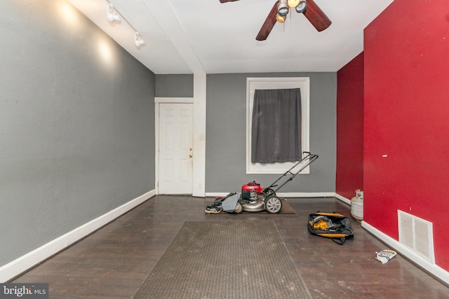 interior space with ceiling fan