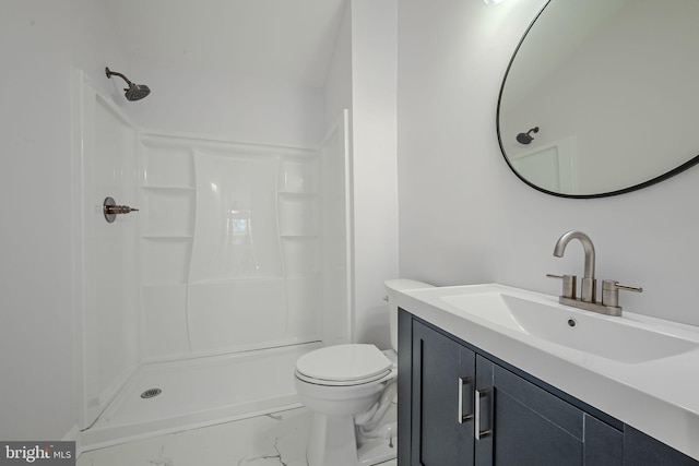 bathroom with walk in shower, vanity, and toilet