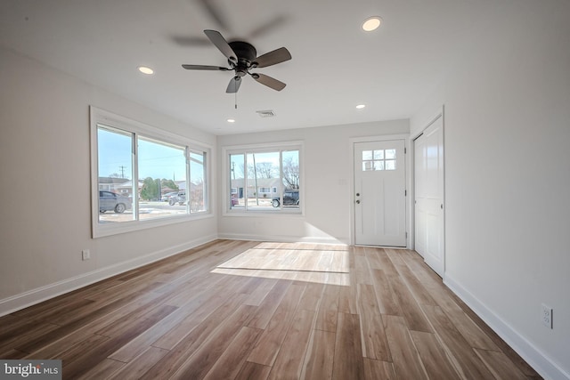 interior space with ceiling fan and light hardwood / wood-style floors