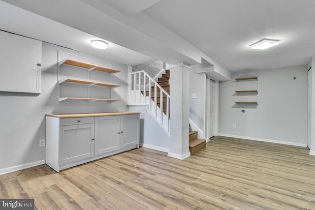 basement featuring light wood-type flooring