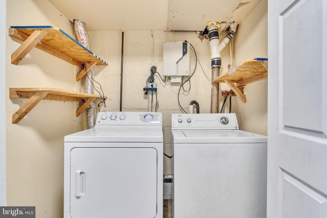 washroom featuring washing machine and dryer