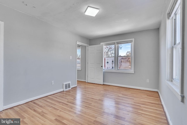 spare room featuring light hardwood / wood-style floors