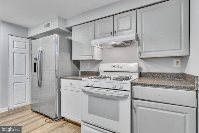 kitchen featuring white cabinets, light hardwood / wood-style floors, white gas range, and stainless steel refrigerator with ice dispenser