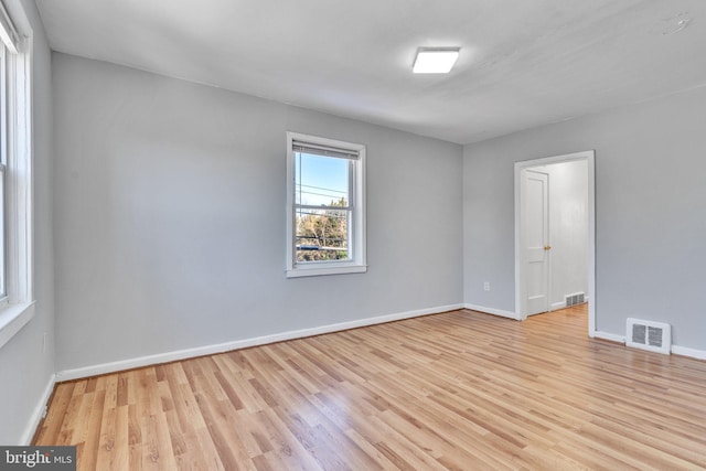 spare room with light hardwood / wood-style floors