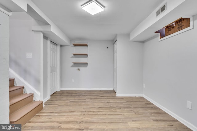 basement featuring light hardwood / wood-style floors