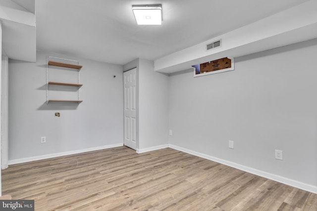 basement featuring light hardwood / wood-style flooring