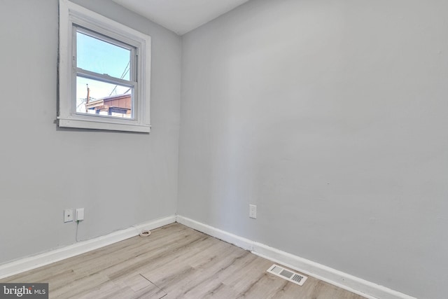 unfurnished room with light hardwood / wood-style floors