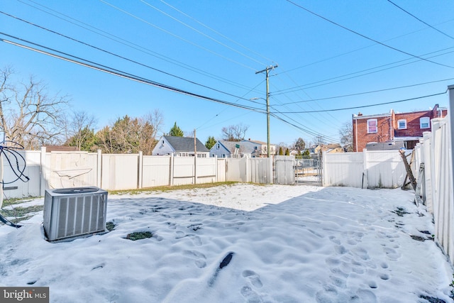 snowy yard with central air condition unit