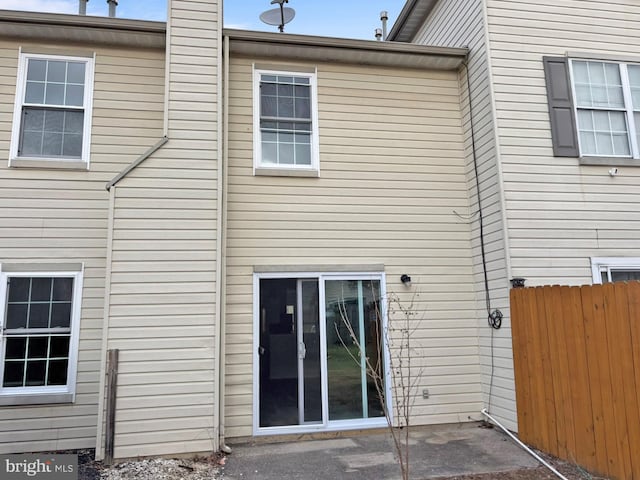 back of house with a patio