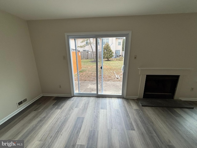 unfurnished living room featuring hardwood / wood-style floors