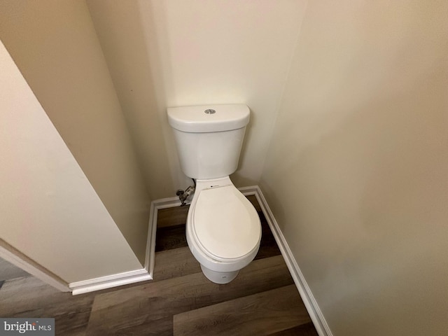 bathroom featuring toilet and hardwood / wood-style floors