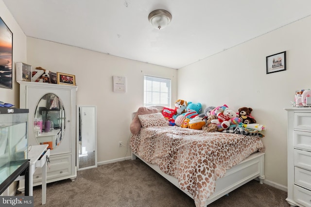 bedroom featuring dark colored carpet