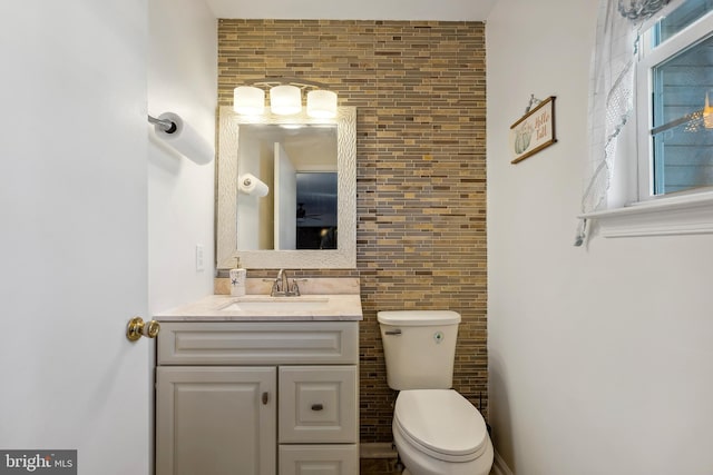 bathroom featuring toilet and vanity