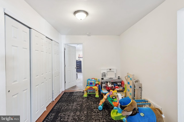 game room with hardwood / wood-style floors