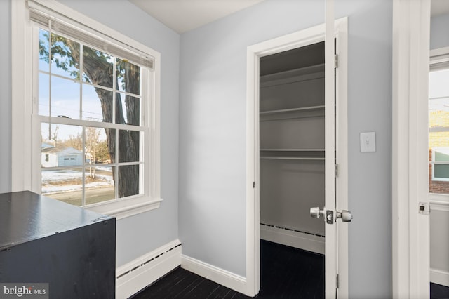 closet with a baseboard heating unit