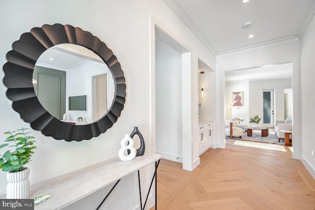 hall with light parquet floors and ornamental molding