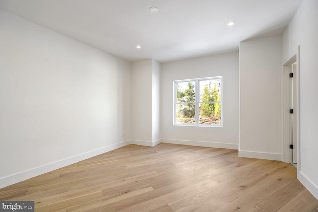 spare room featuring light wood-type flooring