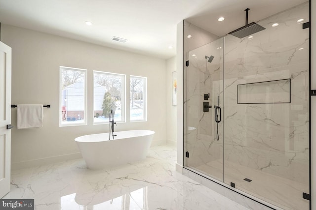 bathroom featuring separate shower and tub