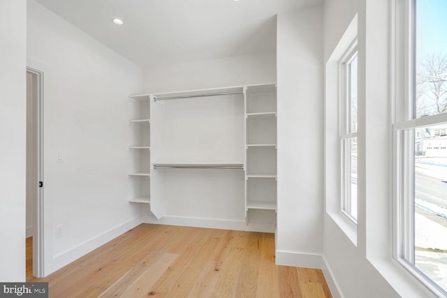 walk in closet featuring hardwood / wood-style floors