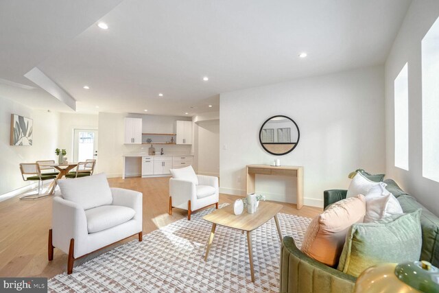 living room with light hardwood / wood-style flooring