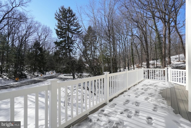 view of snow covered deck