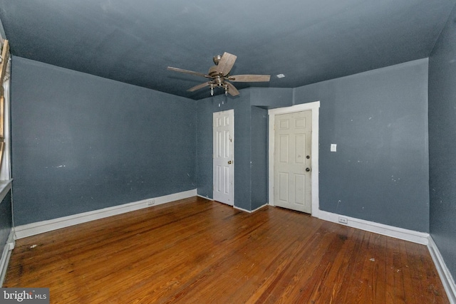 unfurnished room with hardwood / wood-style flooring and ceiling fan