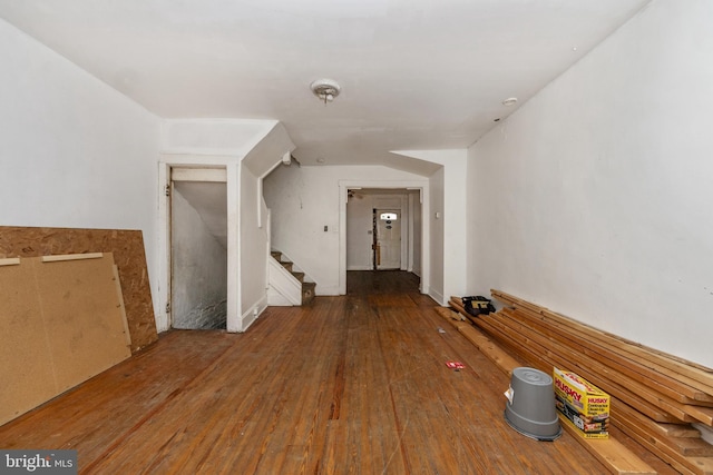 additional living space with wood-type flooring