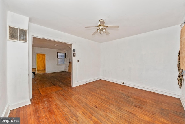 spare room featuring ceiling fan and wood-type flooring