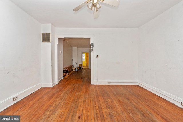 spare room featuring hardwood / wood-style flooring and ceiling fan