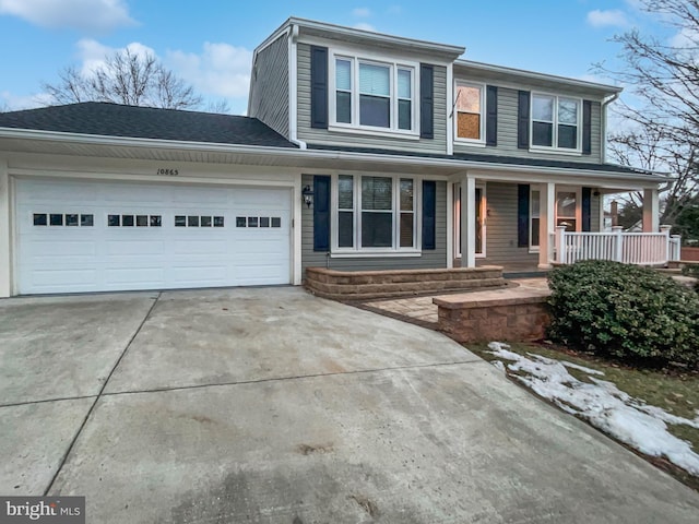 view of front of property featuring a porch and a garage