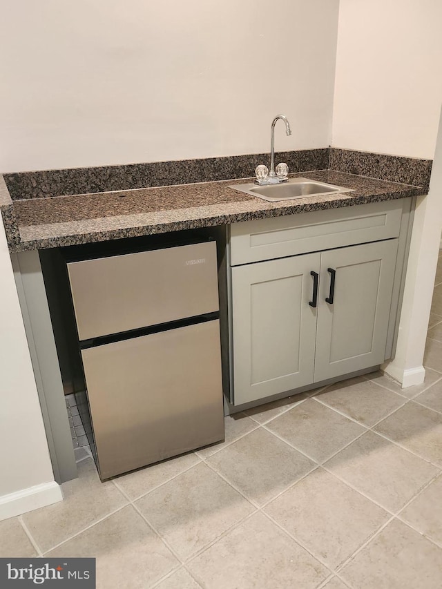 bathroom featuring tile patterned floors and sink