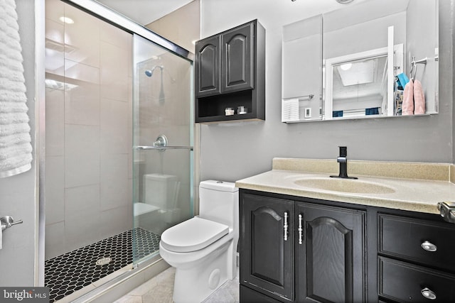 bathroom with walk in shower, vanity, and toilet