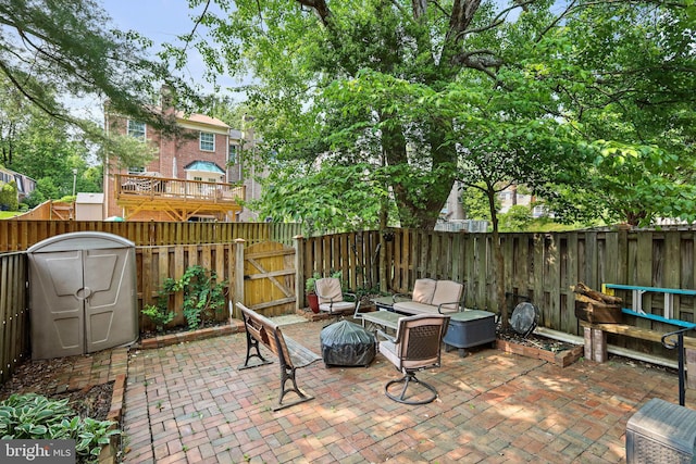 view of patio with an outdoor fire pit