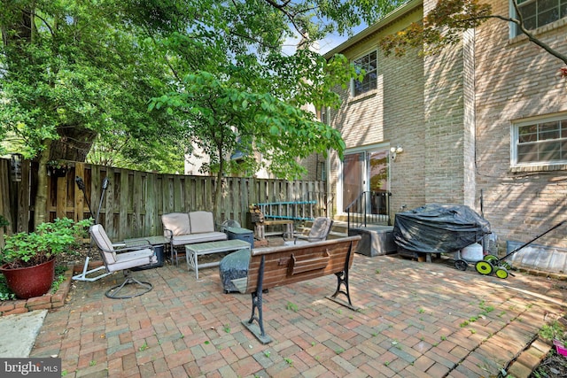 view of patio with a grill and an outdoor hangout area