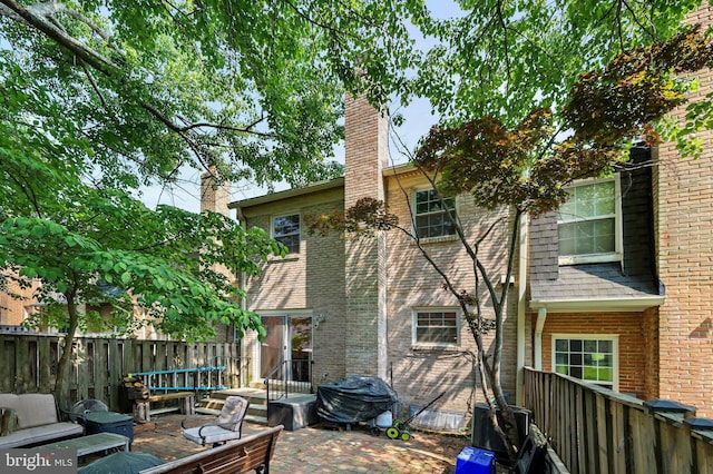 back of property with a patio area