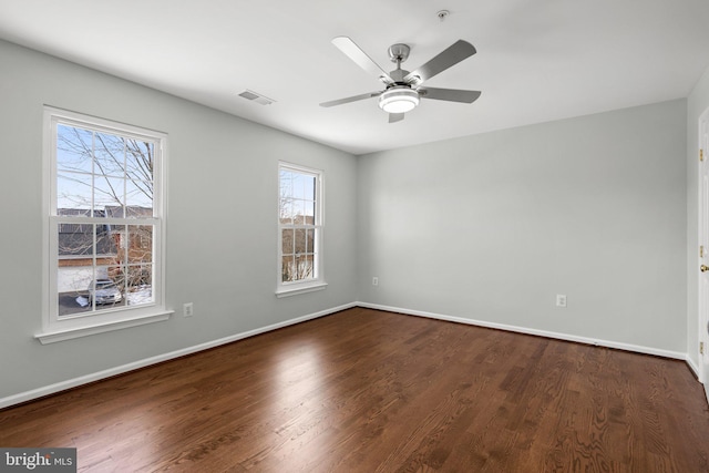 spare room featuring wood-type flooring and ceiling fan