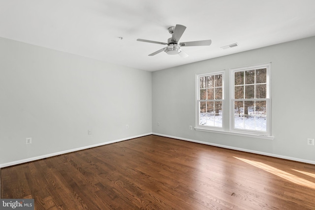 spare room featuring hardwood / wood-style flooring and ceiling fan