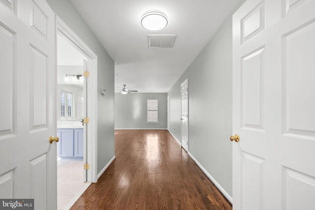 hall with dark hardwood / wood-style flooring
