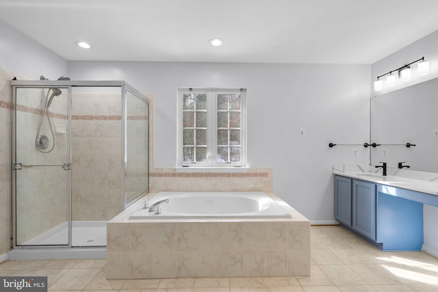 bathroom with vanity, tile patterned flooring, and independent shower and bath