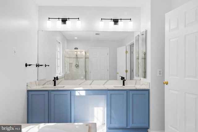 bathroom with walk in shower and vanity